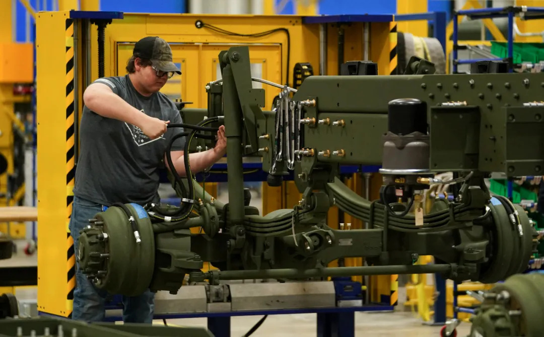 Workers assemble missile launch vehicles in the Lockheed Martin workshop Workers assemble missile launch vehicles in the Lockheed Martin workshop